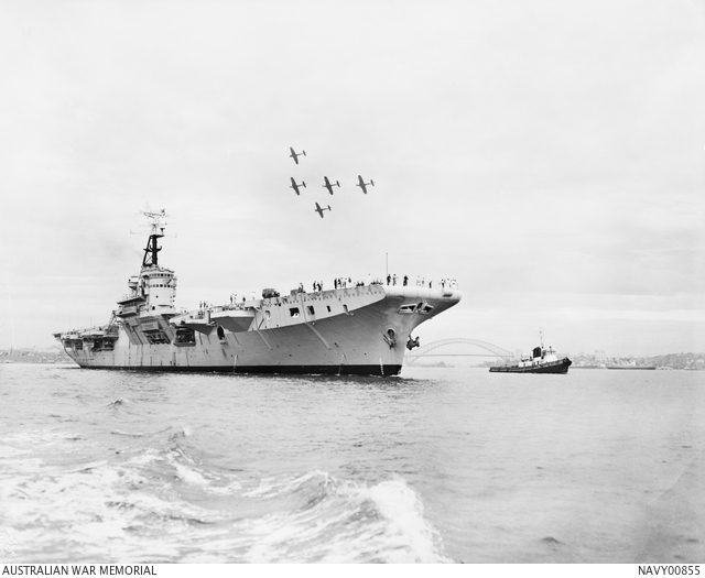 HMAS Sydney 111 with Sydney Harbour Bridge in background and aircraft flying in formation.