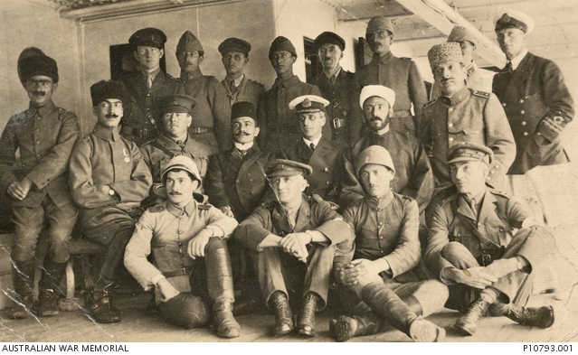 Australian and Ottoman Turkish officers and officials on board the Australian No. 2 Hospital Ship, SS Kanowna. The vessel had arrived at Fouges Bay, about 16 km north of Smyrna, that morning, the day that the Armistice between Turkey and Great Britain and its allies came into force. The purpose of the ship's visit was to pick up Australian, British and Indian prisoners of war (POWs) of the Turks and take them to Egypt. On its departure from Turkish waters the next day were 758 released POWs, including eight women and the crew of the Australian submarine AE2 which had been sunk in the Sea of Marmara in April 1915.